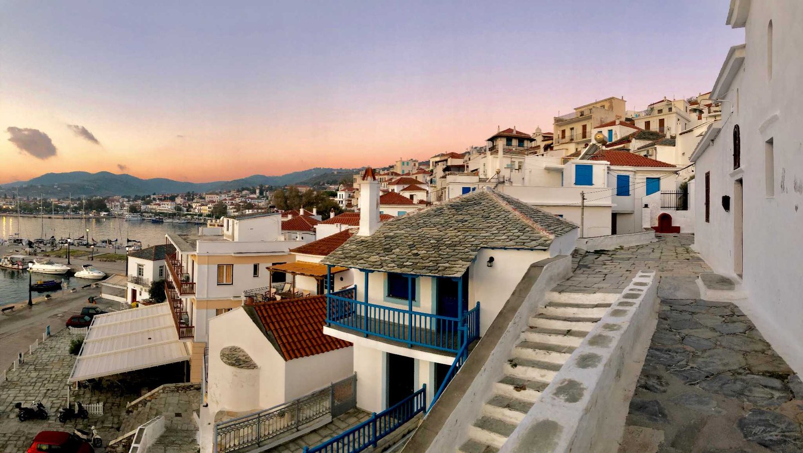 Skopelos Town rooftops and harbour at sunset